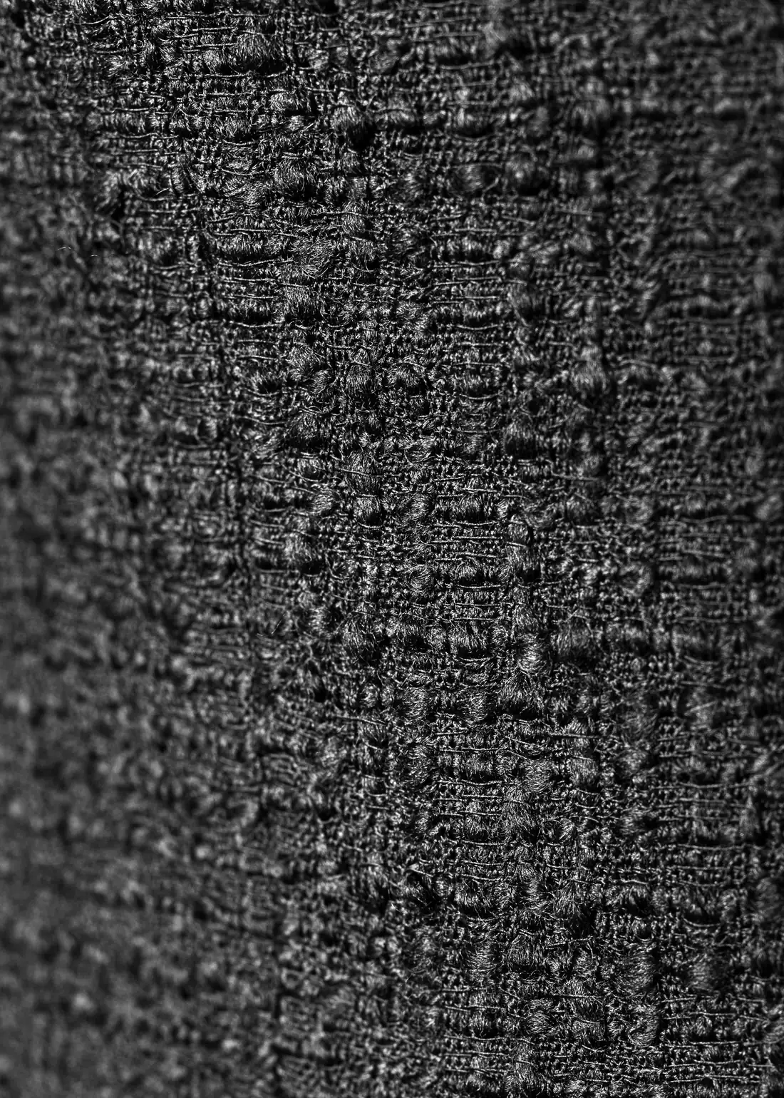 Swatch of black wool bouclé.